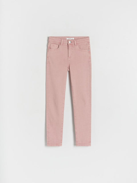 Pink jeans on a light gray background