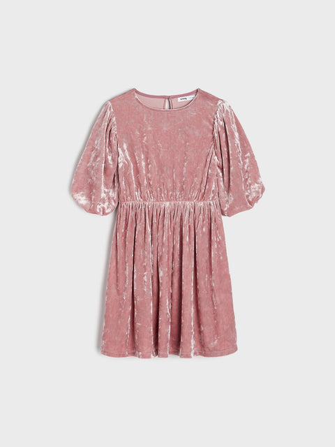 Pink velvet dress on a light gray background