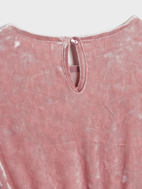 Pink textured garment with a close-up of the neckline on a light gray background