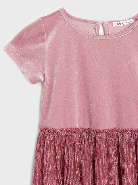 Pink dress with a textured bottom half on a white background