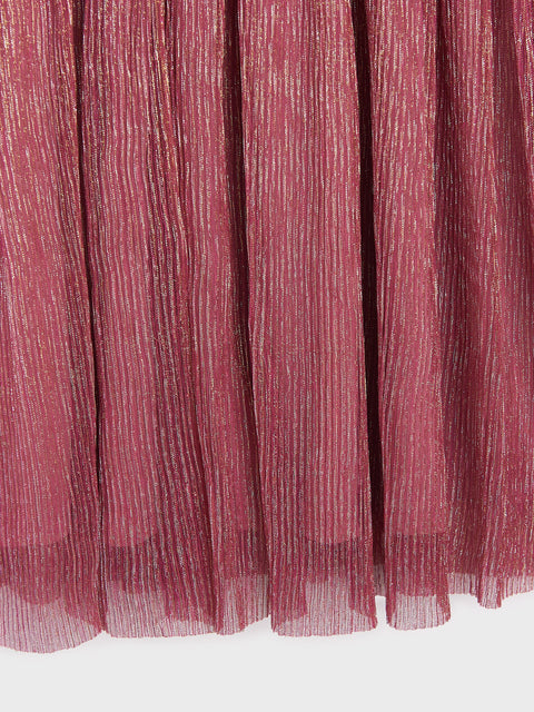 Close-up of a pleated pink fabric with a white background