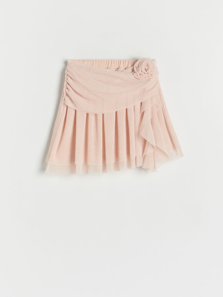 Pink skirt with floral detail on a white background