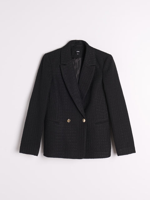 Black checkered blazer with gold buttons on a light gray background