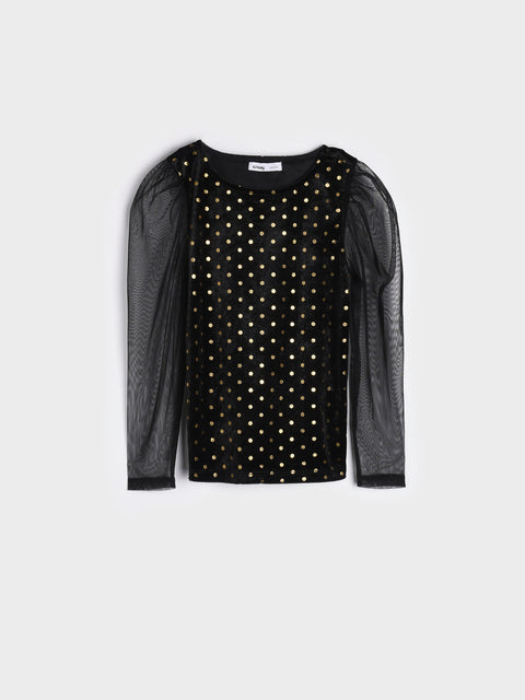 Black top with sheer sleeves and gold polka dots on a white background