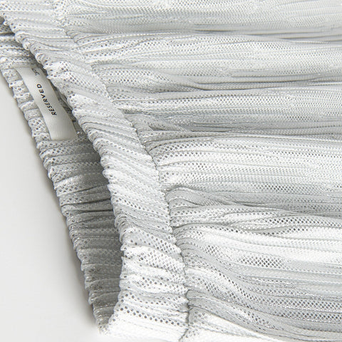Close-up of textured fabric with 'Rohmer' branding on a white background