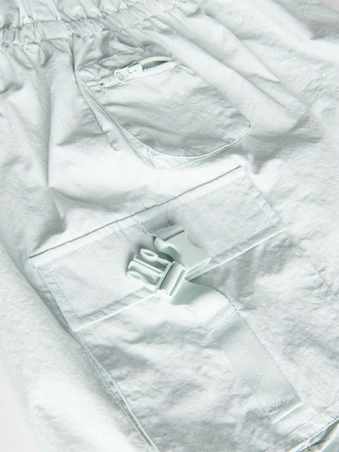 Close-up of a white jacket with a brand logo on a white background