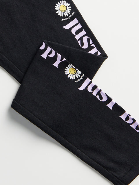 Black leggings with 'Just Do It' and daisy flower design on a light gray background