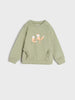 Light green sweatshirt with fox design on a white background