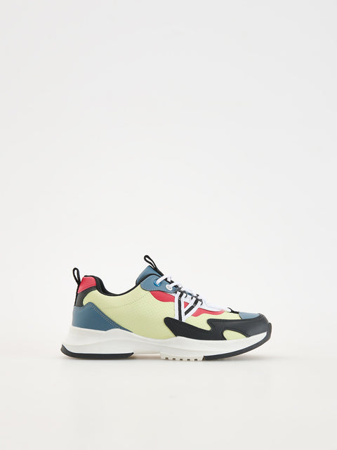 Multicolored sneaker on a light gray background