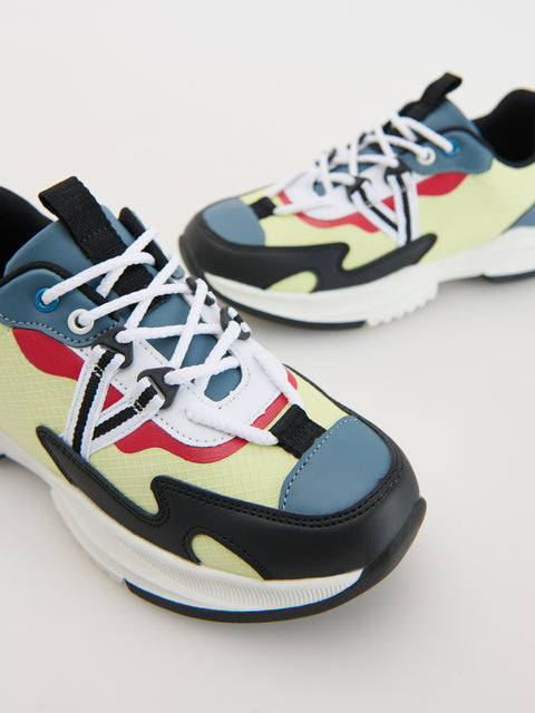 Colorful sneakers with a abstract pattern on a light gray background
