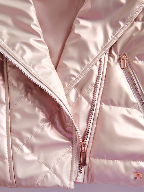 Close-up of a pink quilted jacket with a zipper