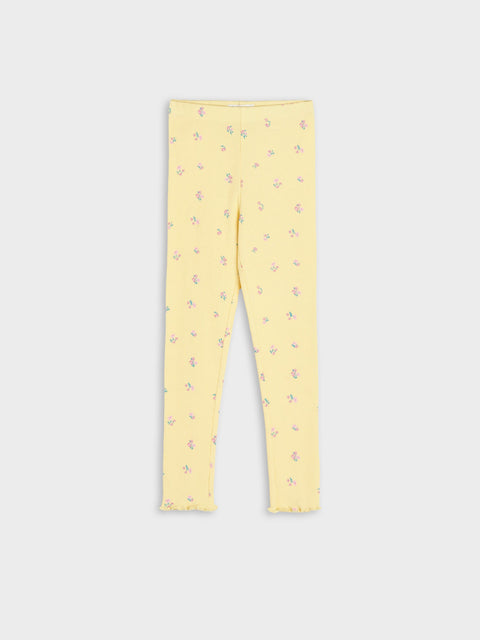 Yellow leggings with a subtle pattern on a light gray background