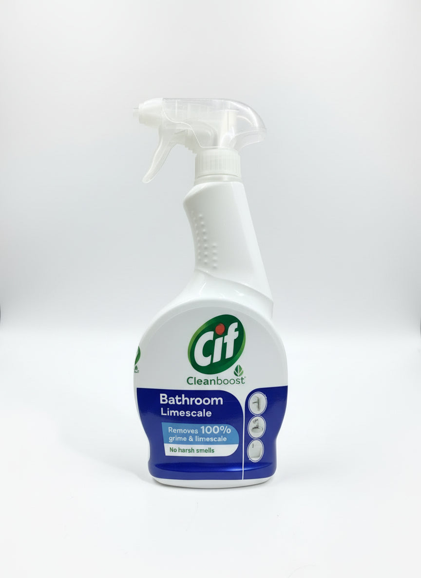 Cif Bathroom Limescale cleaning spray bottle held by a hand on a stone surface