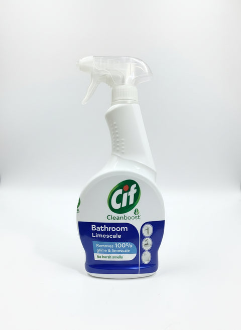 Cif Bathroom Limescale cleaning spray bottle held by a hand on a stone surface