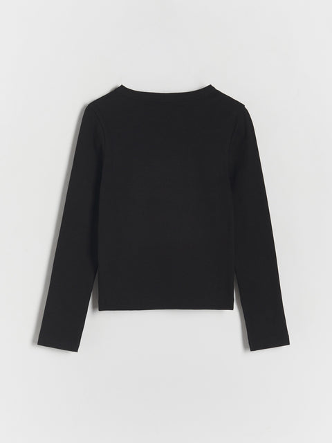 Black long-sleeve top on a light gray background