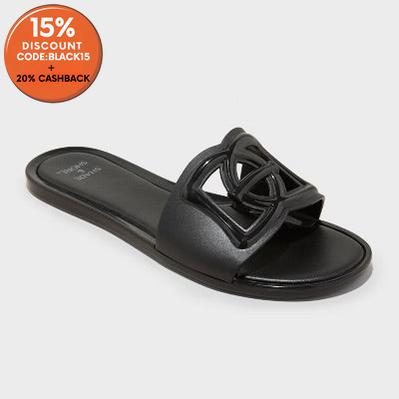 Black sandal with a decorative buckle on a white background