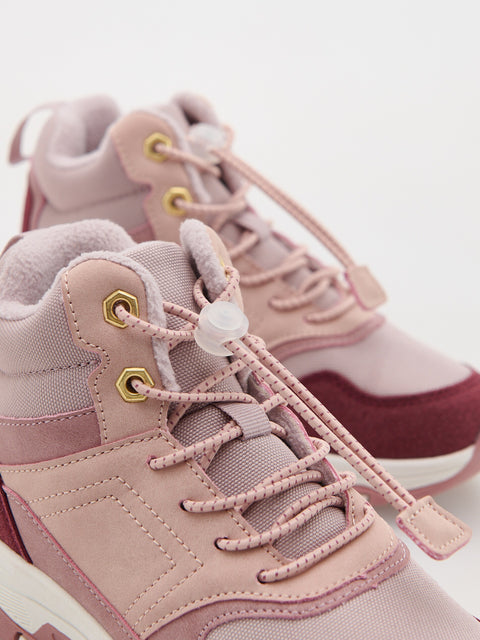 Pink high-top sneakers with white laces on a light background