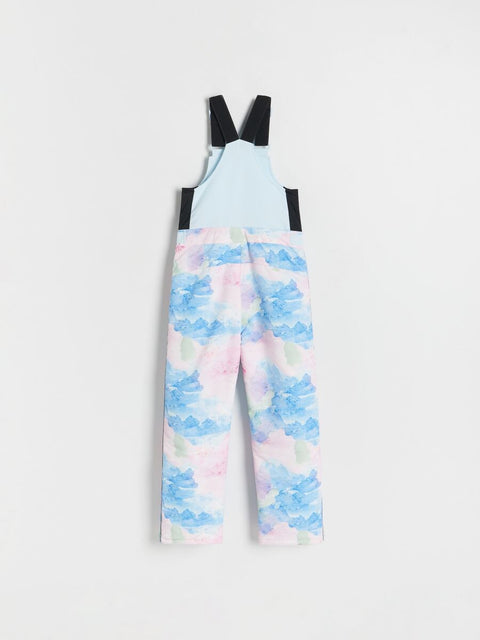 Children's overalls with a pastel cloud pattern on a white background