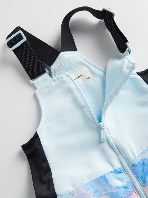 Light blue and black jacket with a visible brand label on a light gray background