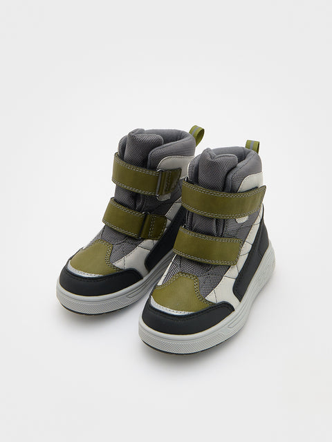 Pair of high-top sneakers with green and gray accents on a white background