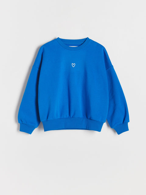 Blue sweatshirt with a white heart on a light gray background