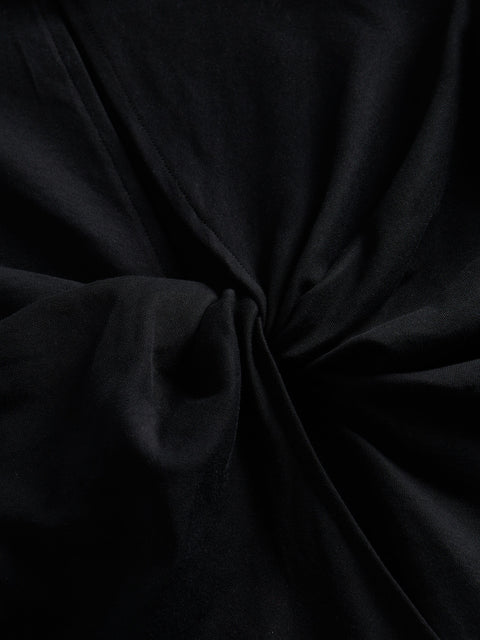 Close-up of dark black fabric with folds
