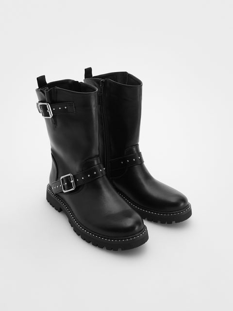 Pair of black leather boots with buckles on a white background