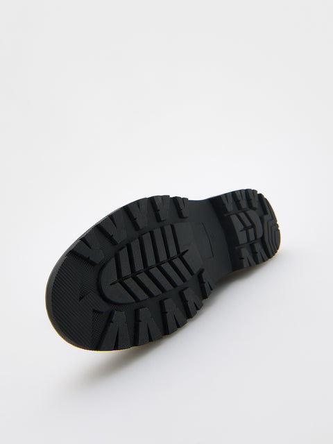 Black sole of a shoe on a white background