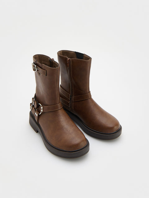 Pair of brown leather boots with buckles on a white background
