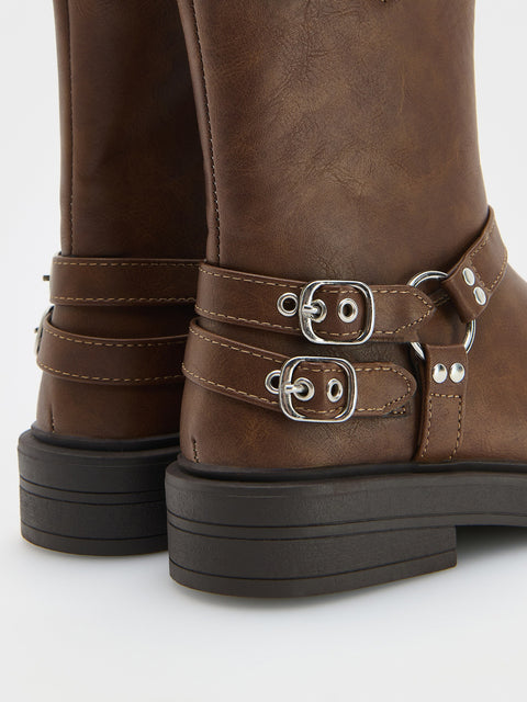 Brown leather boots with buckles on a white background
