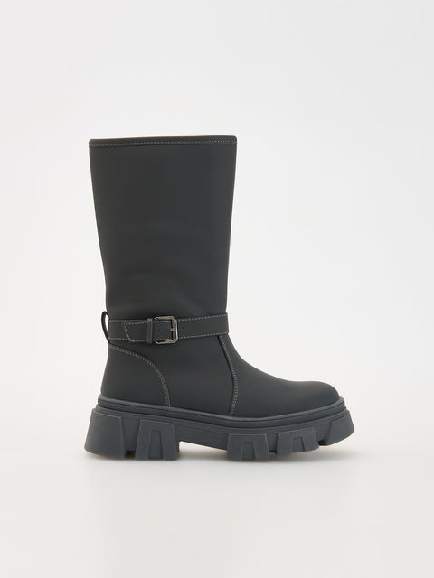 Black boot with a buckle on a white background
