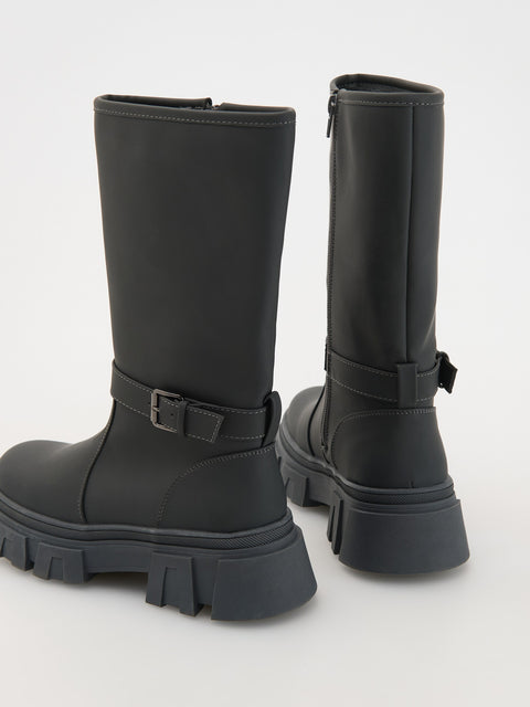 Black combat boots with buckles on a white background