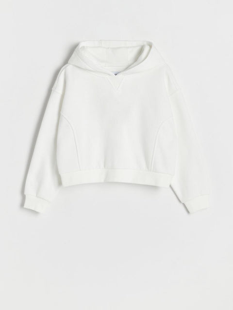 White long-sleeve top on a light gray background