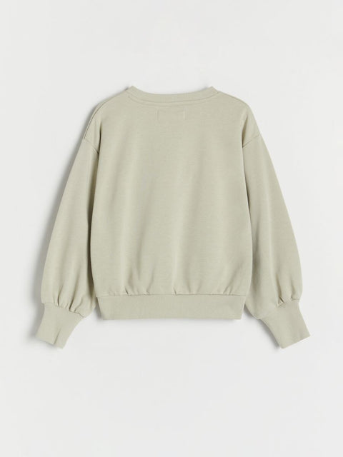 Light beige sweatshirt on a white background