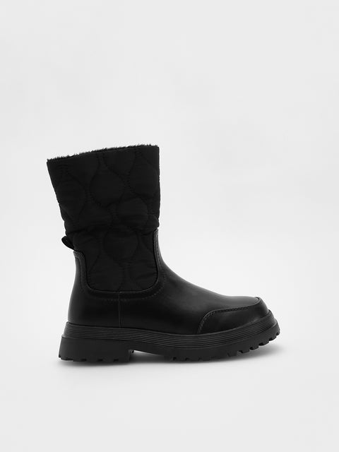 Black boot with quilted design on a white background