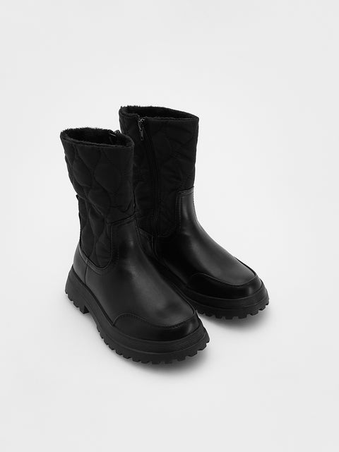Pair of black rubber boots on a light gray background