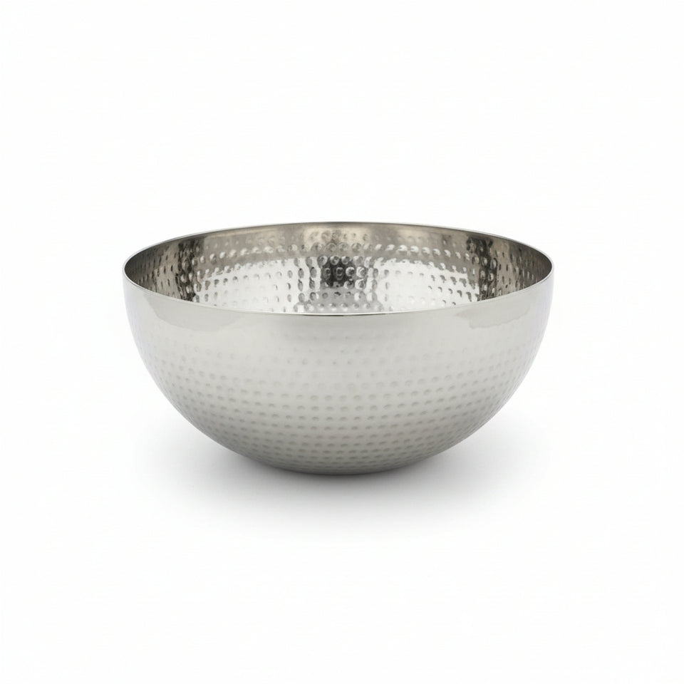 Silver hammered metal bowl on a white background