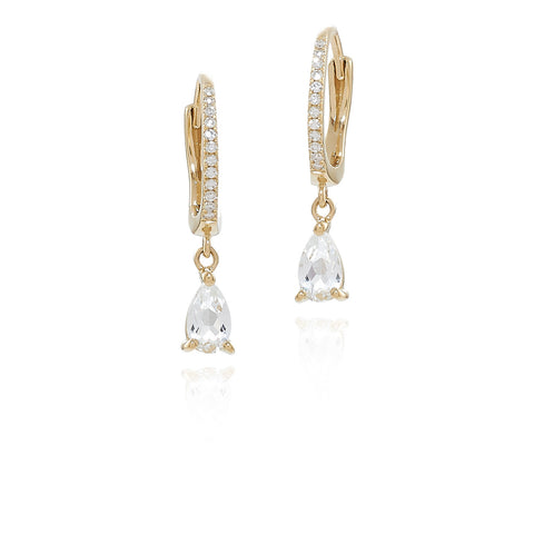 Gold hoop earrings with teardrop-shaped clear gemstones on a white background
