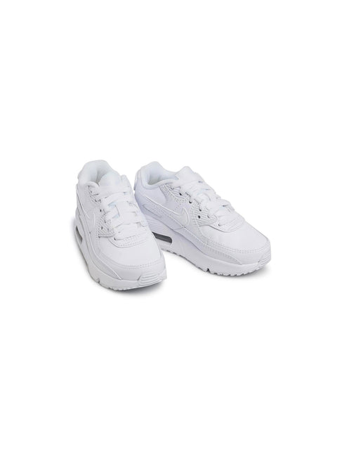 Pair of white sneakers on a white background