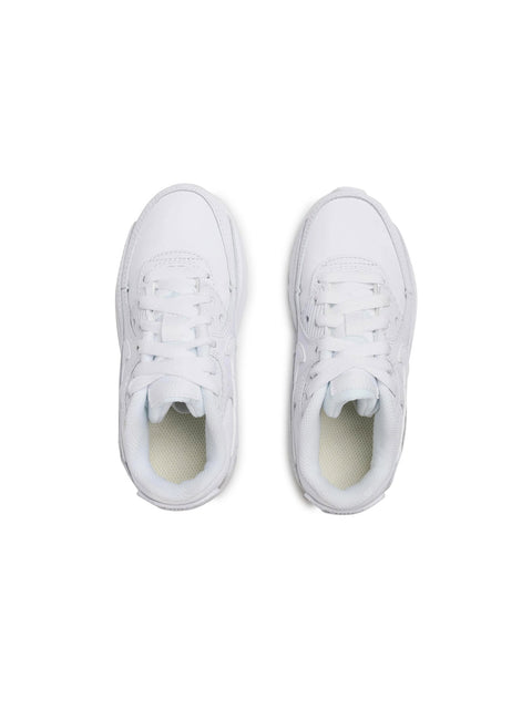 Pair of white sneakers on a white background