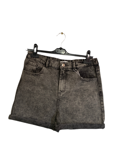 Black denim shorts on a hanger against a white background