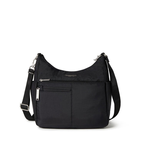 Black handbag with a strap on a white background