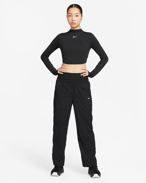 Person wearing a black Nike outfit on a white background