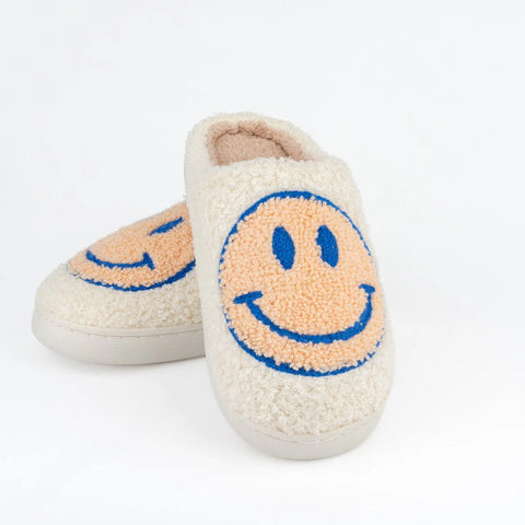 Pair of slippers with smiley face design on a white background