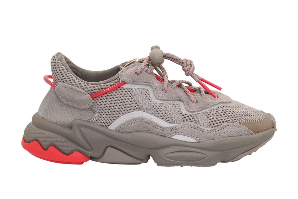 Gray sneaker with red accents on a white background