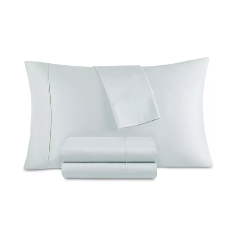 Set of light gray bedding including a pillow and two fitted sheets on a white background