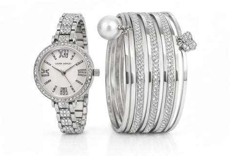 Silver watch and bracelet set on a white background