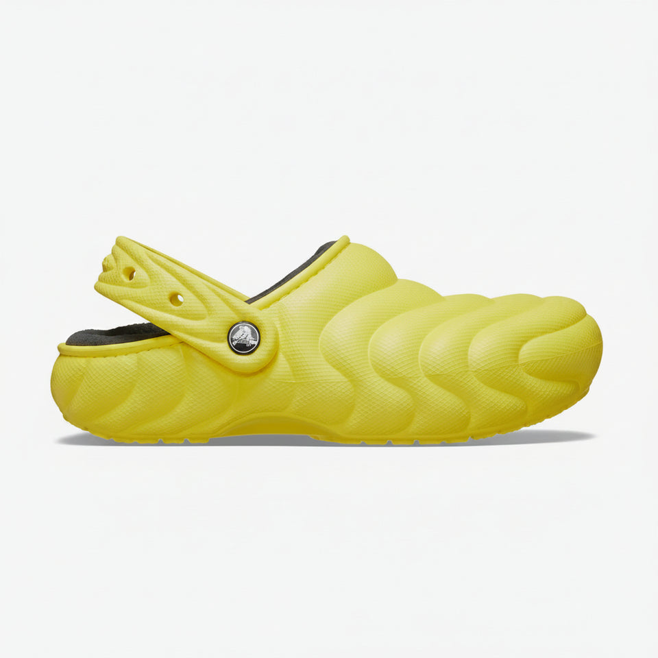 Yellow clog shoe on a white background