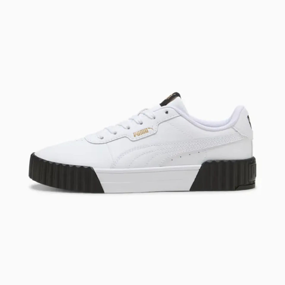 White sneaker with black soles on a white background