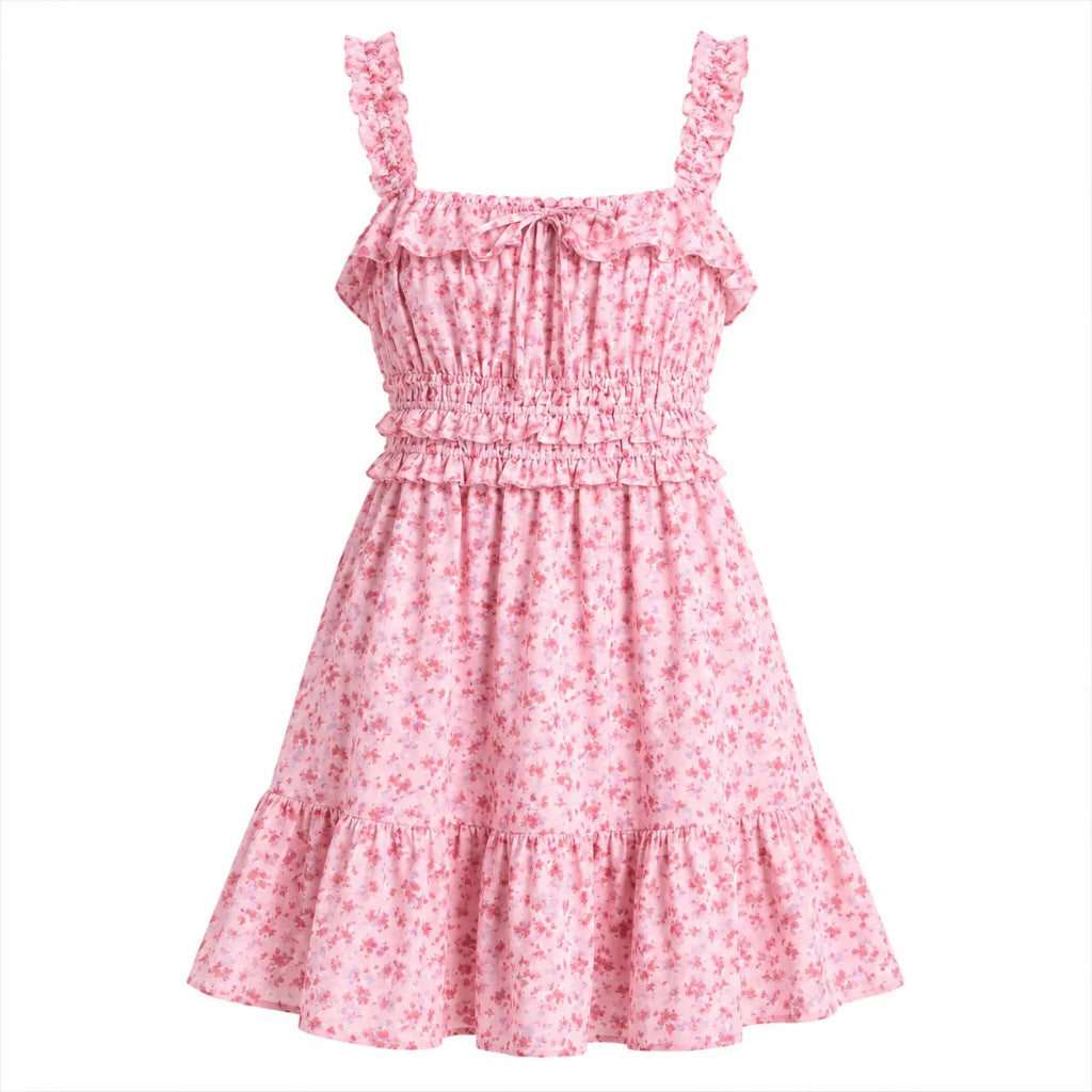 A pink floral print sleeveless dress with ruffled straps, a smocked bodice, and tiered skirt, shown against a plain white background.